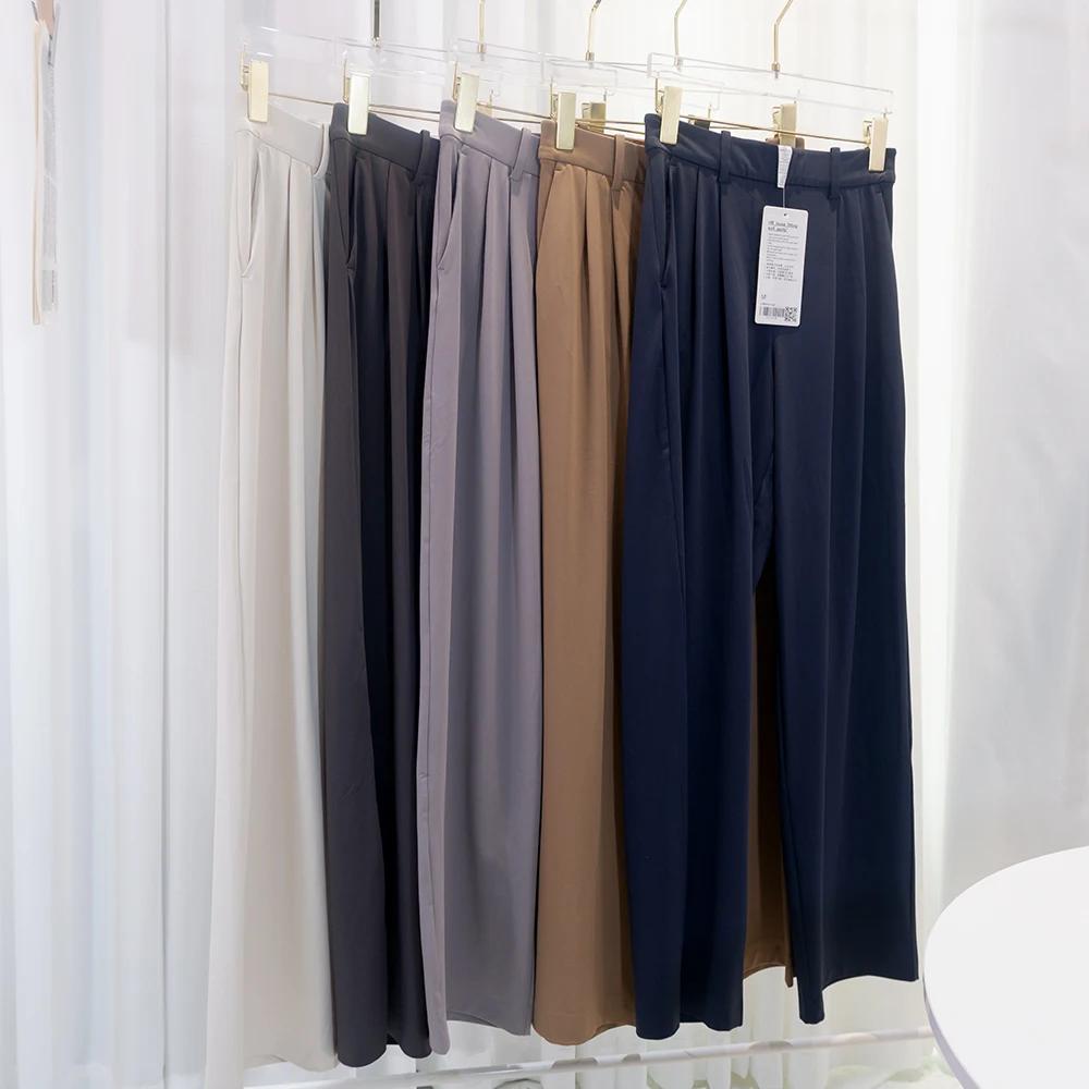 Pantalon de costume à poches avec plis